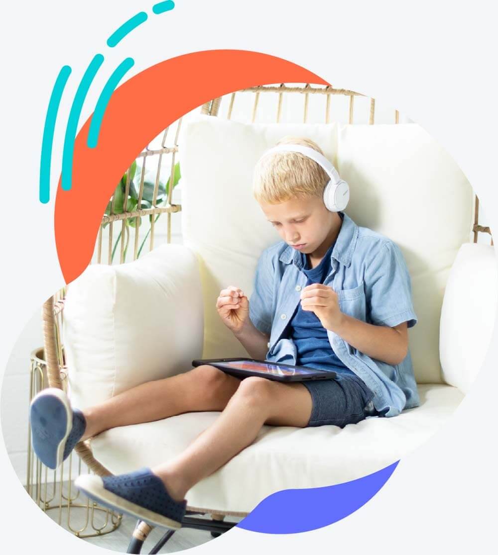 boy sitting on a couch and playing Lexercise games on the ipad 