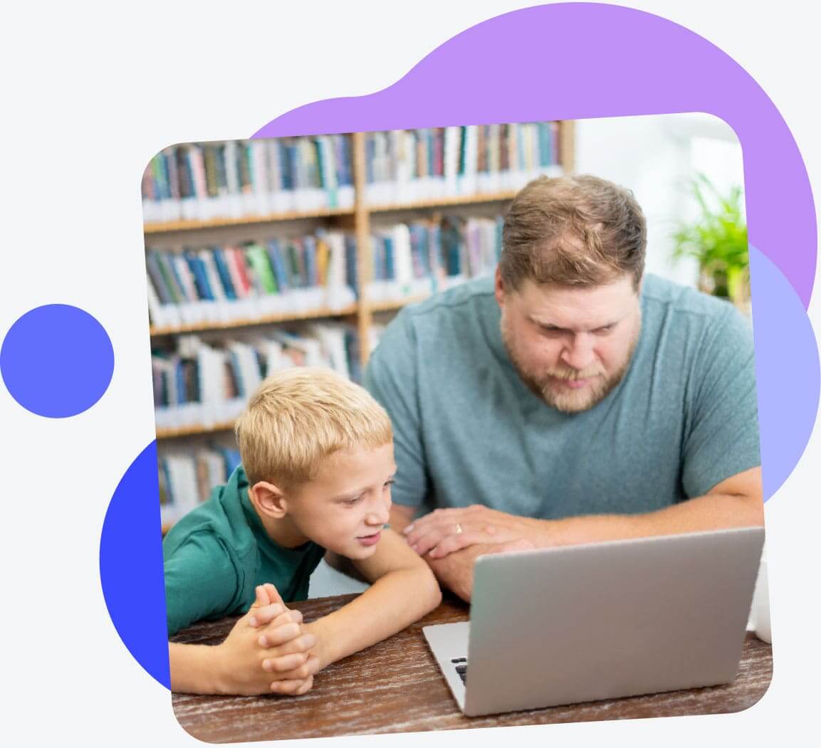 Father and son meet with a dyslexia tutor via a video conference